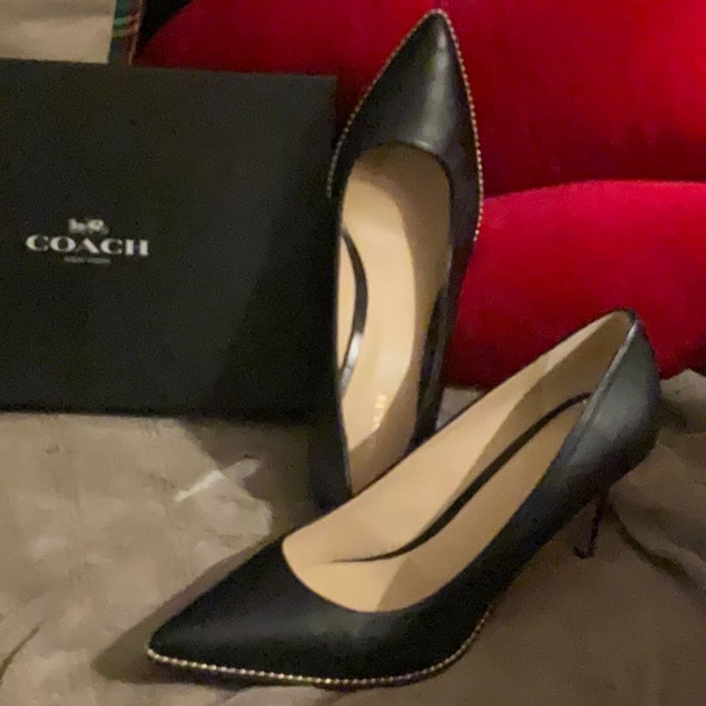 Coach black Heels with gold detailing.